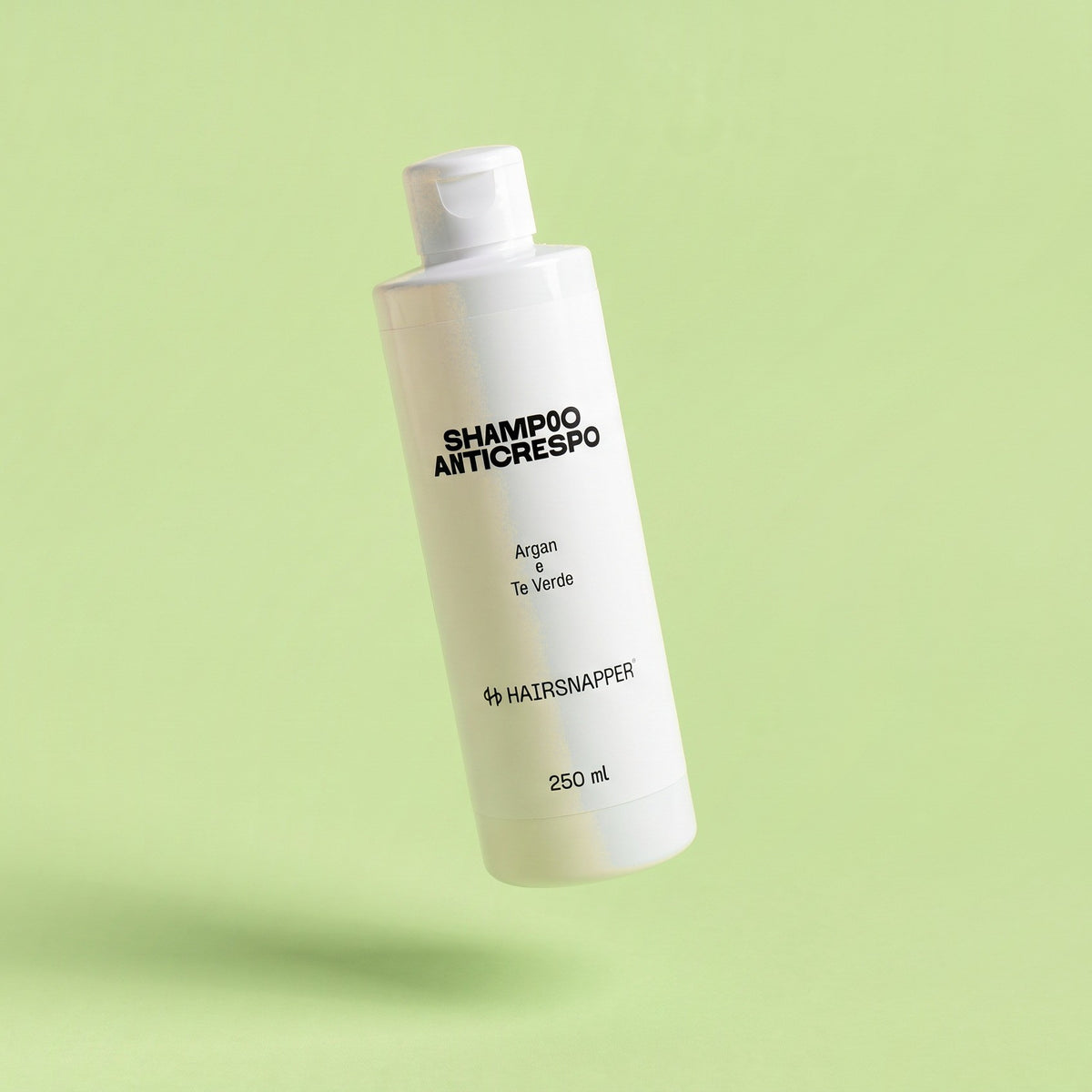 HairSnapper Shampoo Anticrespo 250 ml sospeso su fondo pistacchio