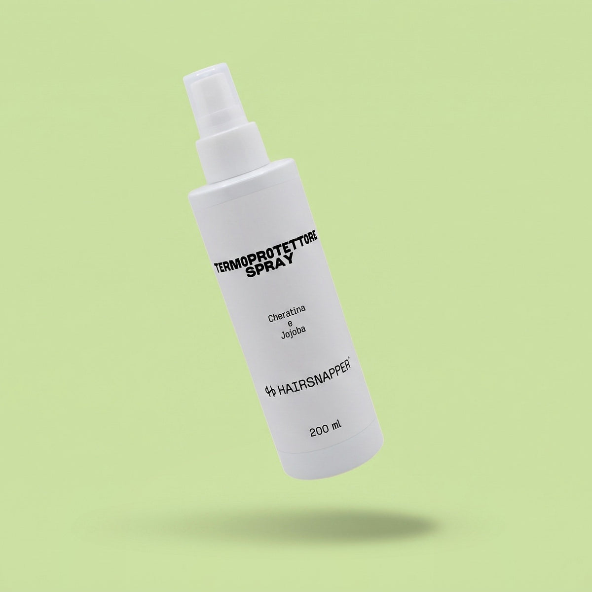 HairSnapper Termoprotettore Spray 200 ml sospeso su fondo pistacchio